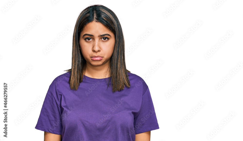 Young hispanic girl wearing casual purple t shirt depressed and worry for distress, crying angry and afraid. sad expression. Young hispanic girl wearing casual purple t shirt depressed and worry for distress, crying angry and afraid. sad expression.