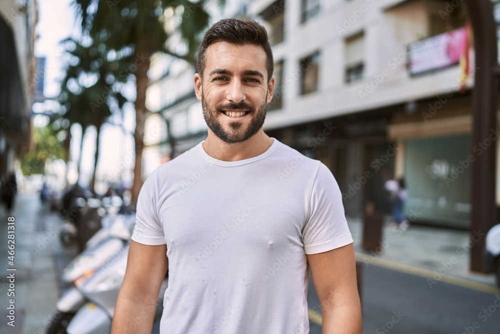 Young hispanic man smiling confident walking at street Young hispanic man smiling confident walking at street