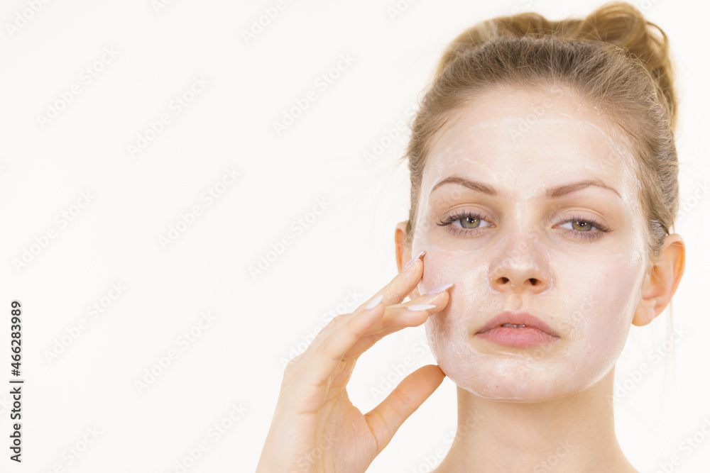 Girl with cream moisture cosmetic on face