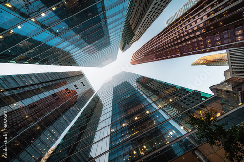 Looking up at modern skyscrapers against blue sky in the financial district of Toronto in Ontario, Canada, business and finance concept.	