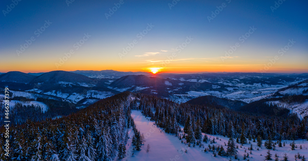 Picturesque winter panorama of snowy mountain hills