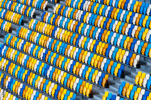 Closeup of yellow and blue seats on stadium