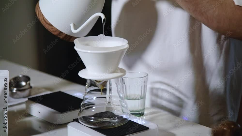 The process of brewing specialty coffee. Brewing coffee in a funnel