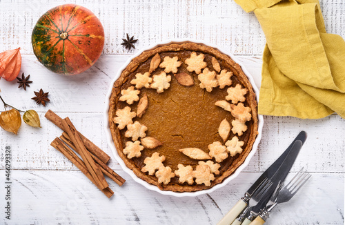 Pumpkin Pie. Tart with whipped cream and cinnamon on white rustic background. Traditional american homemade pumpkin cake for Thanksgiving or Halloween Ready to eat. Mock up.