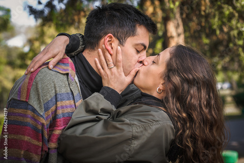 Close-up of French kiss. Couple in love hugging and kissing