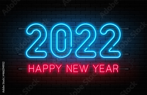 Happy New Year 2022. New Year and Christmas neon signboard with glowing text and numbers. Neon light effect for background, banner, poster and greeting card