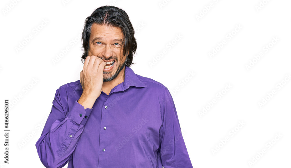 Middle age handsome man wearing business shirt looking stressed and nervous with hands on mouth biting nails. anxiety problem. Middle age handsome man wearing business shirt looking stressed and nervous with hands on mouth biting nails. anxiety problem.