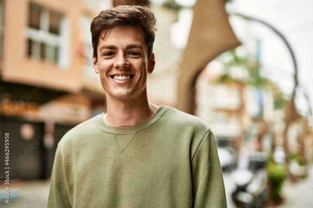 Young hispanic man smiling happy standing at the city. Young hispanic man smiling happy standing at the city.
