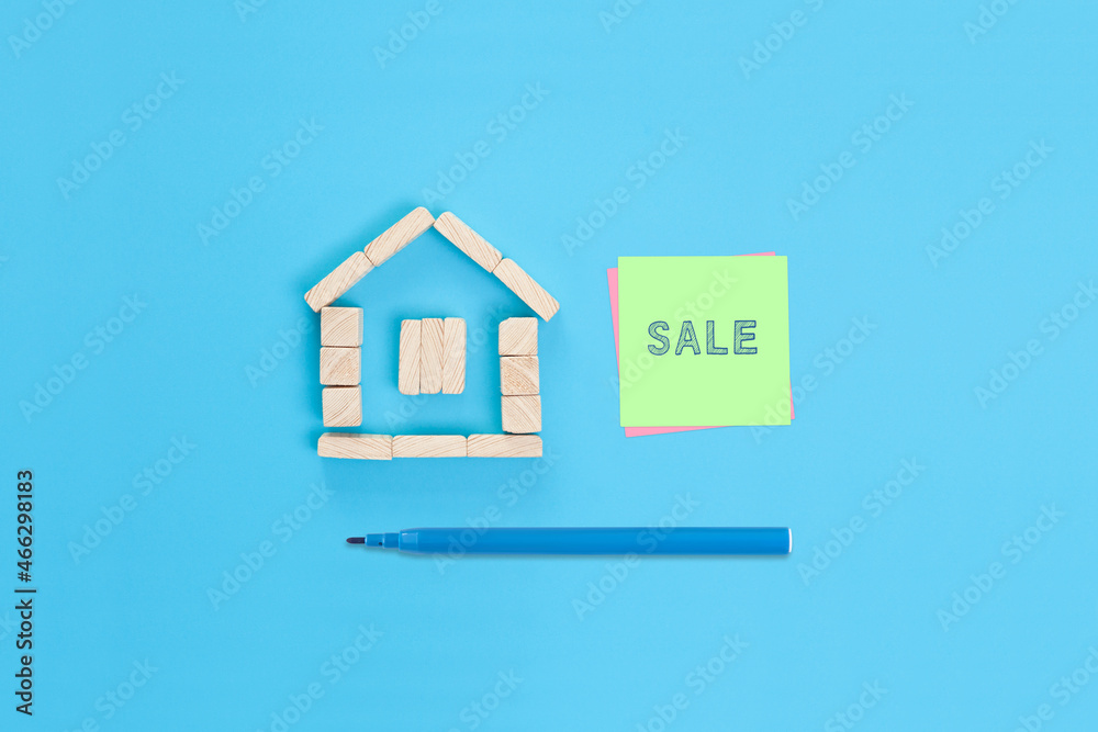A sticky note with the word Sale