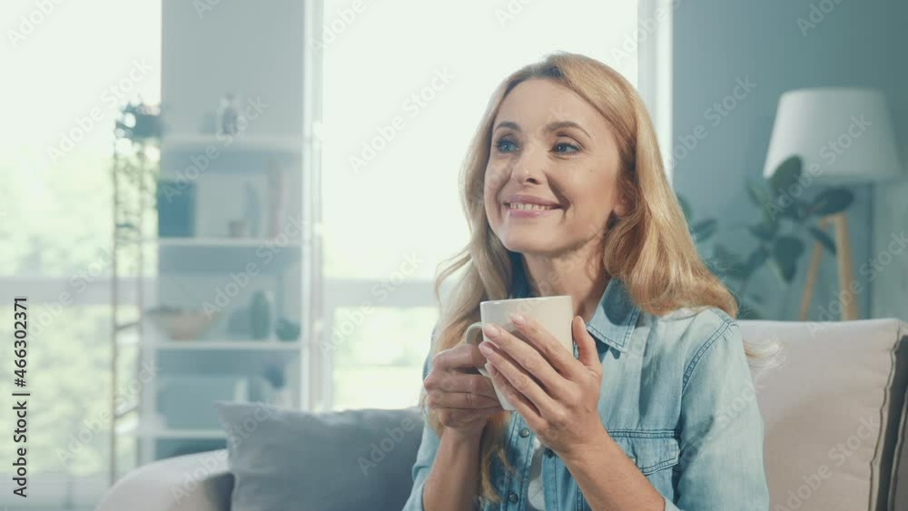 Positive blonde lady hold tea mug enjoy work pause Positive blonde lady hold tea mug enjoy work pause