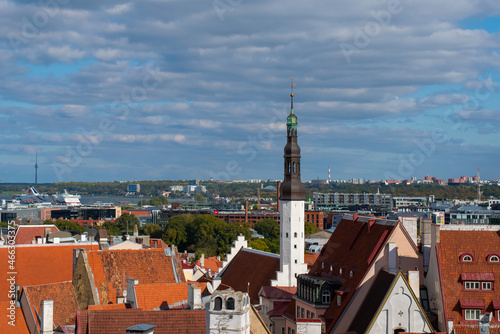 Aerial view of the old town of Tallinn. Red tiled roofs of the old medieval houses on a sunny autumn day. Tallinn city centre on a background.