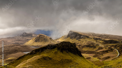 Dramatic landscape Isle of Skye, part of the Scottish Highlands and Islands, iconic and famous landmark of the Quirang during a morning storm and weather front