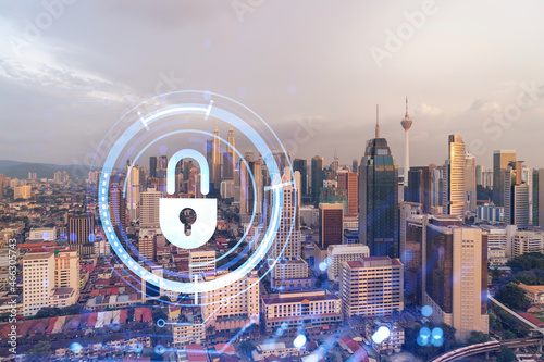 Canvas Print Padlock hologram on sunset panoramic cityscape of Kuala Lumpur, Malaysia, Asia