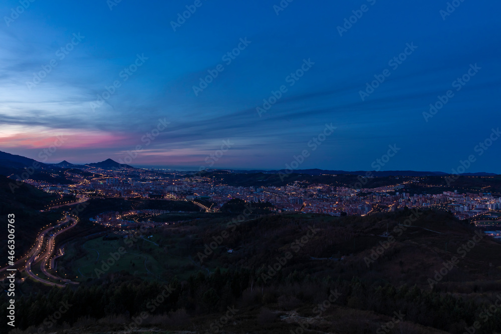 panoramic view of Bilbao at sunset from a nearby hill