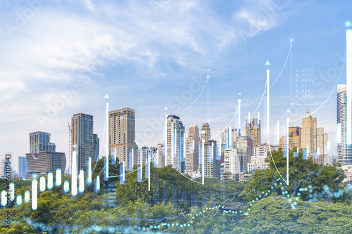 Financial stock chart hologram over panorama city view of Bangkok, business center in Southeast Asia. The concept of international transactions. Double exposure.
