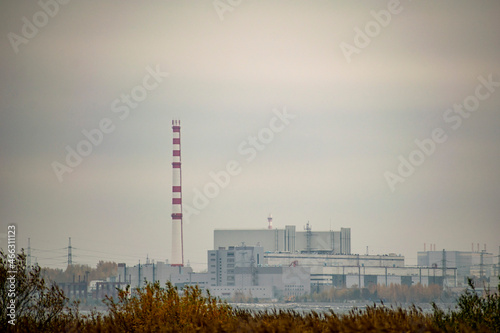 Nuclear power plant. Buildings in the haze of autumn haze. Energy concept.