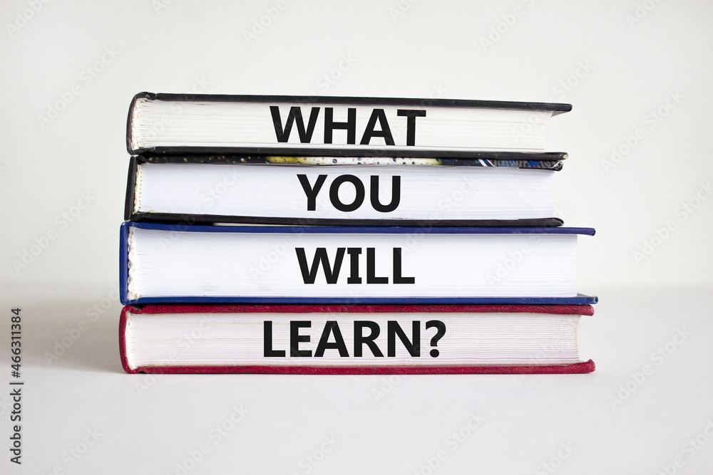 What you will learn symbol. Concept words What you will learn on books on a beautiful white background. Business, psychological and what you will learn concept. Copy space.