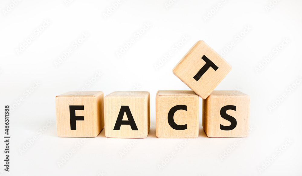 Facts symbol. The concept word 'facts' on wooden cubes. Beautiful white table, white background, copy space. Business, fact and facts concept. Facts symbol. The concept word 'facts' on wooden cubes. Beautiful white table, white background, copy space. Business, fact and facts concept.