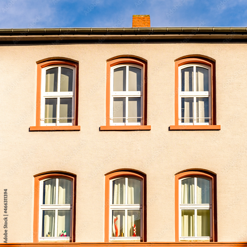 facade of an house with windows near Frankfurt Hauptbahnhof in a sunny morning and blue sky
