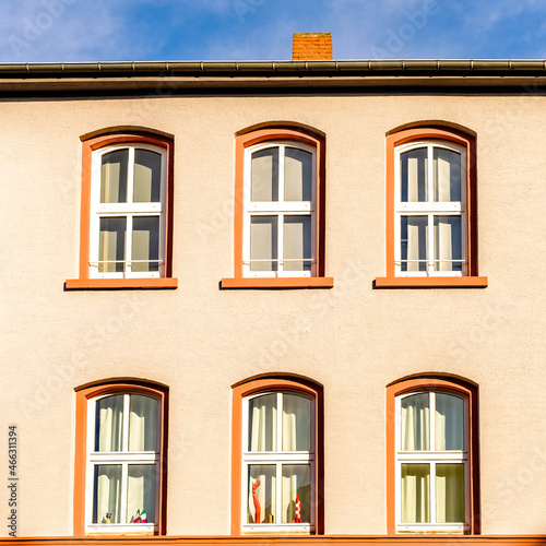 facade of an house with windows near Frankfurt Hauptbahnhof in a sunny morning and blue sky