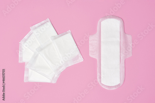 packaged cotton sanitary pad napkin on pink background