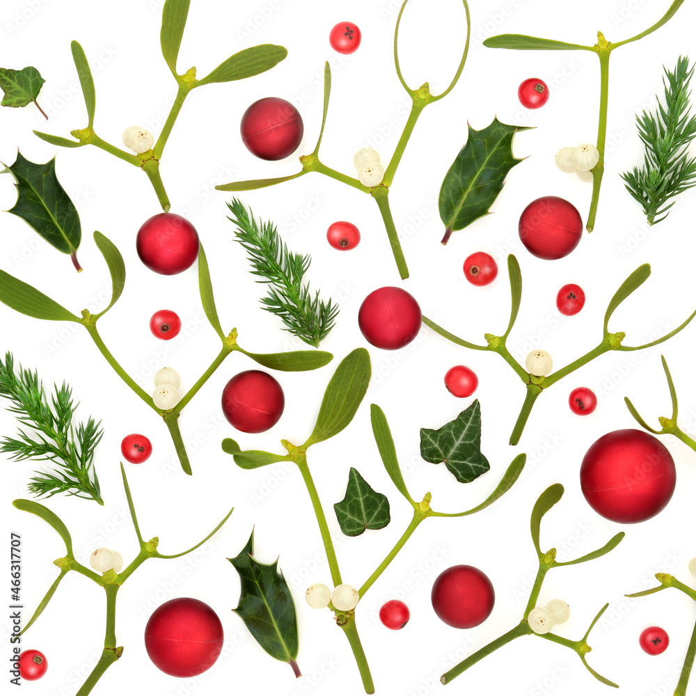 Christmas composition with red ball bauble tree decorations, mistletoe, holly berries and juniper fir on white. Festive nature background for the holiday season. Flat lay, top view. Christmas composition with red ball bauble tree decorations, mistletoe, holly berries and juniper fir on white. Festive nature background for the holiday season. Flat lay, top view.