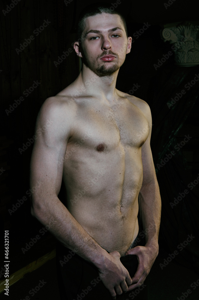 Fototapeta premium Young attractive guy posing in the studio.