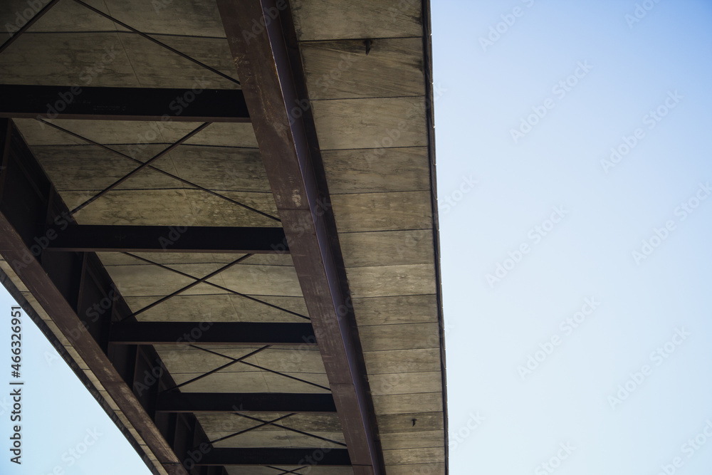 Bridge seen from below with the sky in the background. Selective focus. Bridge seen from below with the sky in the background. Selective focus.