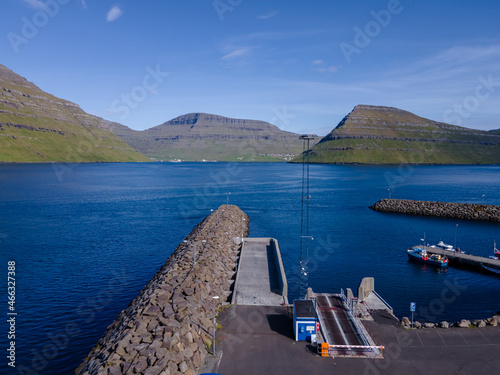 Beautiful aerial view of Sydradalur port and village near the Seal woman statue in the Faroe Islands photo