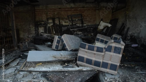 Homeless shelter burned down in a fire. The remains of a house where poor hobo people lived damaged and destructed in arson. Homelessness social documentary concept.