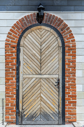 An old door in a stone wall