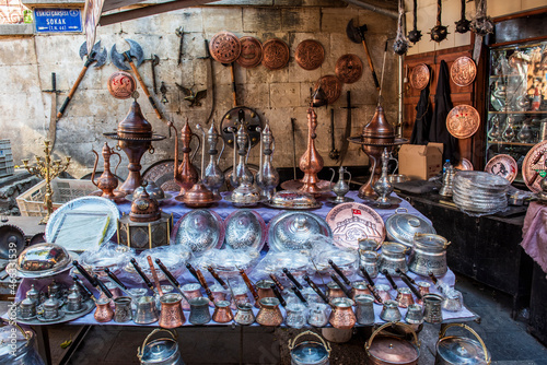 GAZIANTEP, TURKEY - OCTOBER 24, 2021: Coppersmith Bazaar of Gaziantep (Turkish: Bakircilar Carsisi). Handmade copper products and shopping center. Historical coppersmith shopping center. photo