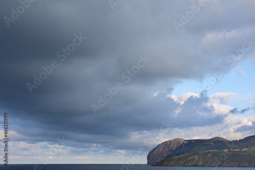 Walk through Mundaka. The coastal town of Mundaka in the Urdaibai biosphere reserve. Views of Cape Ogoño from Mundaka. photo