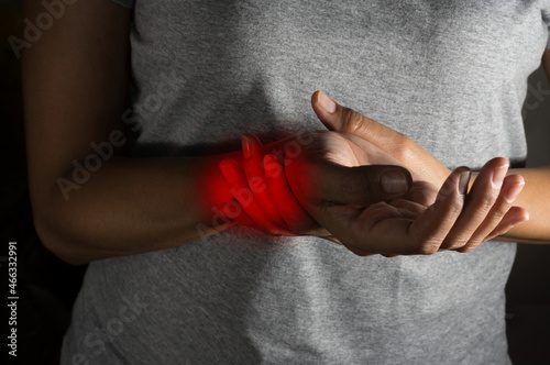 Female suffering with wrist pain. © peerayot