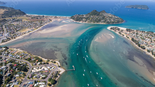 blue river enters the sea seen from the drone at Kopu