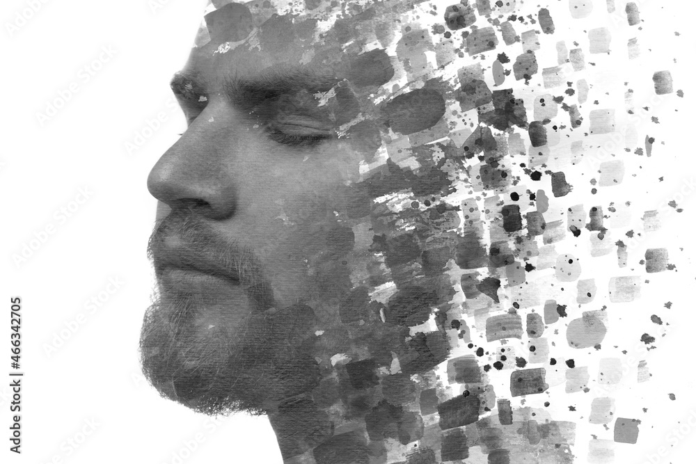 Paintography. A black and white portrait of a young handsome man combined with black ink splashes. Paintography. A black and white portrait of a young handsome man combined with black ink splashes.
