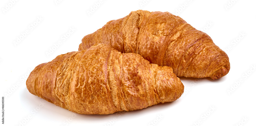 Freshly baked croissants, isolated on white background.
