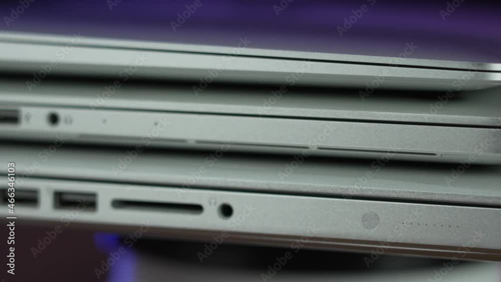 A rotating extreme closeup view of the ports on three different generations of modern laptops. A rotating extreme closeup view of the ports on three different generations of modern laptops.