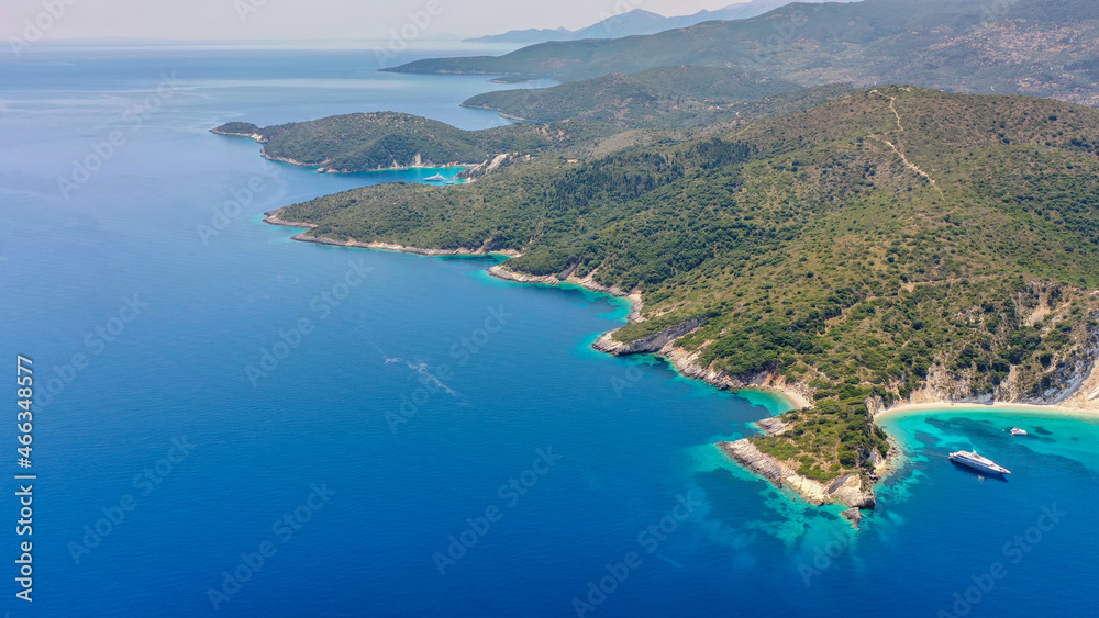 Aerial panoramic wide photo of paradise turquoise Gidaki beach and moored luxury boats in Ithaca Greece