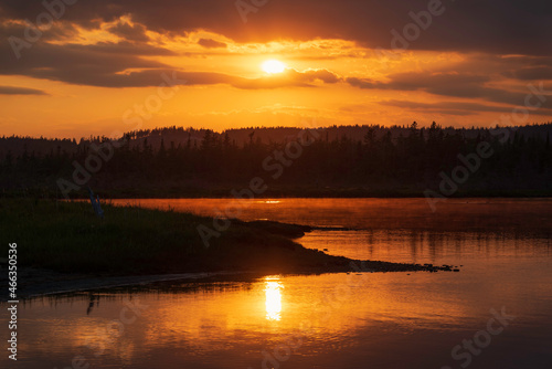 Orange Sunset reflecting on marsh