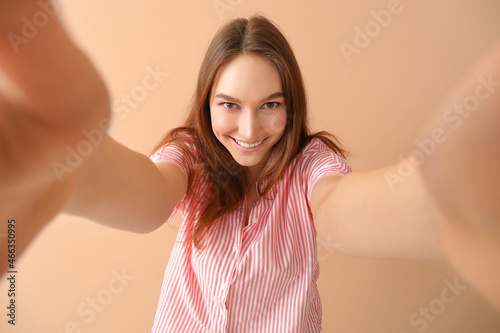 Happy young woman taking se...