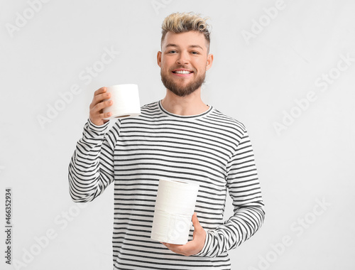 Young man with toilet paper...