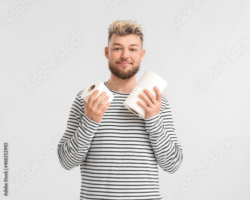 Young man with toilet paper...