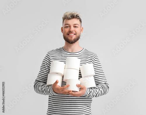 Happy young man with many r...