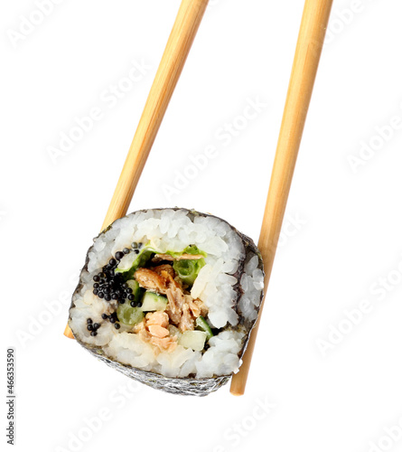 Chopsticks with tasty maki roll on white background
