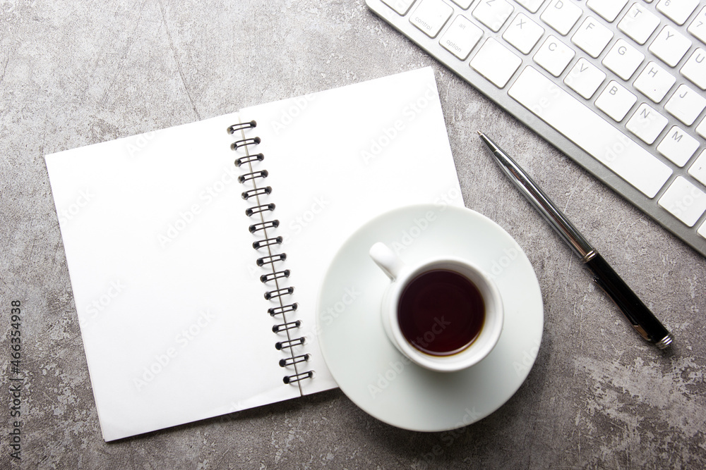 White desk office with laptop, smartphone and other work supplies with cup of coffee. Top view with copy space for input the text. Designer workspace on desk table essential elements on flat lay White desk office with laptop, smartphone and other work supplies with cup of coffee. Top view with copy space for input the text. Designer workspace on desk table essential elements on flat lay