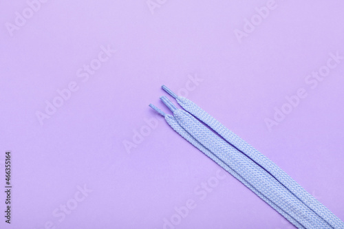 Light blue shoelaces on pur...