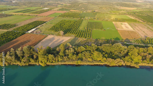 Aerial view of trees and farmland next to Acheloos river in West Greece