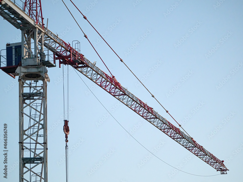 Construction crane on a construction site used for the construction of residential houses Construction crane on a construction site used for the construction of residential houses