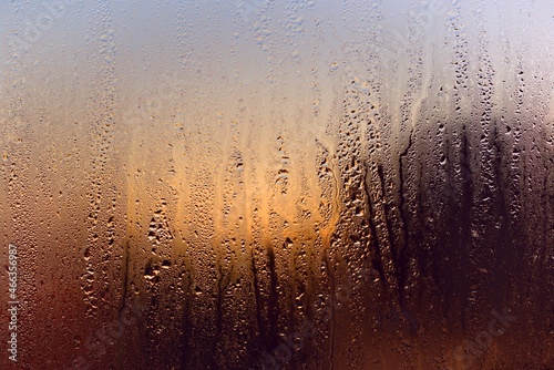 Water drops on a window, on a cold winter morning.